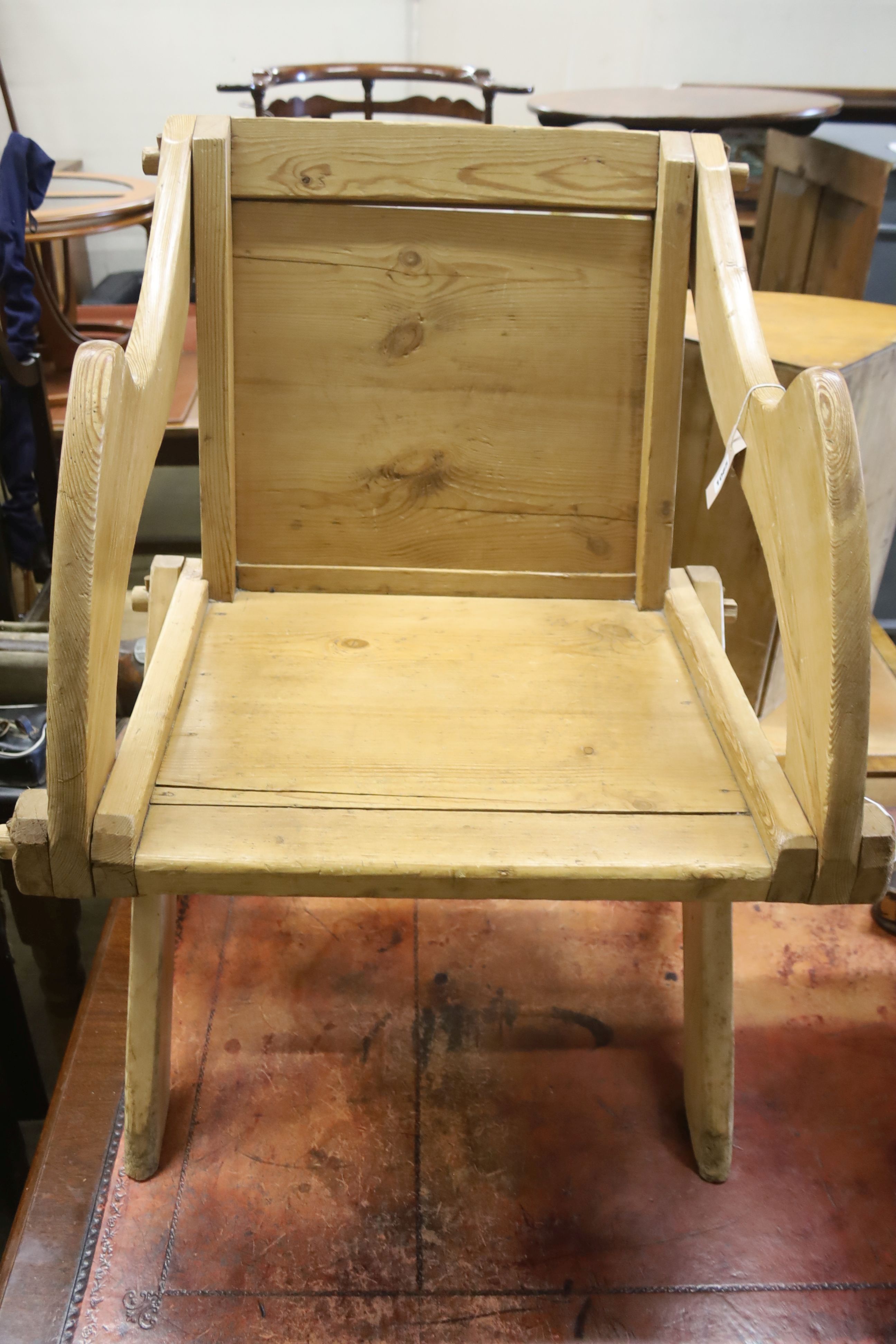 A Victorian pine Glastonbury type chair, width 69cm, depth 54cm, height 88cm